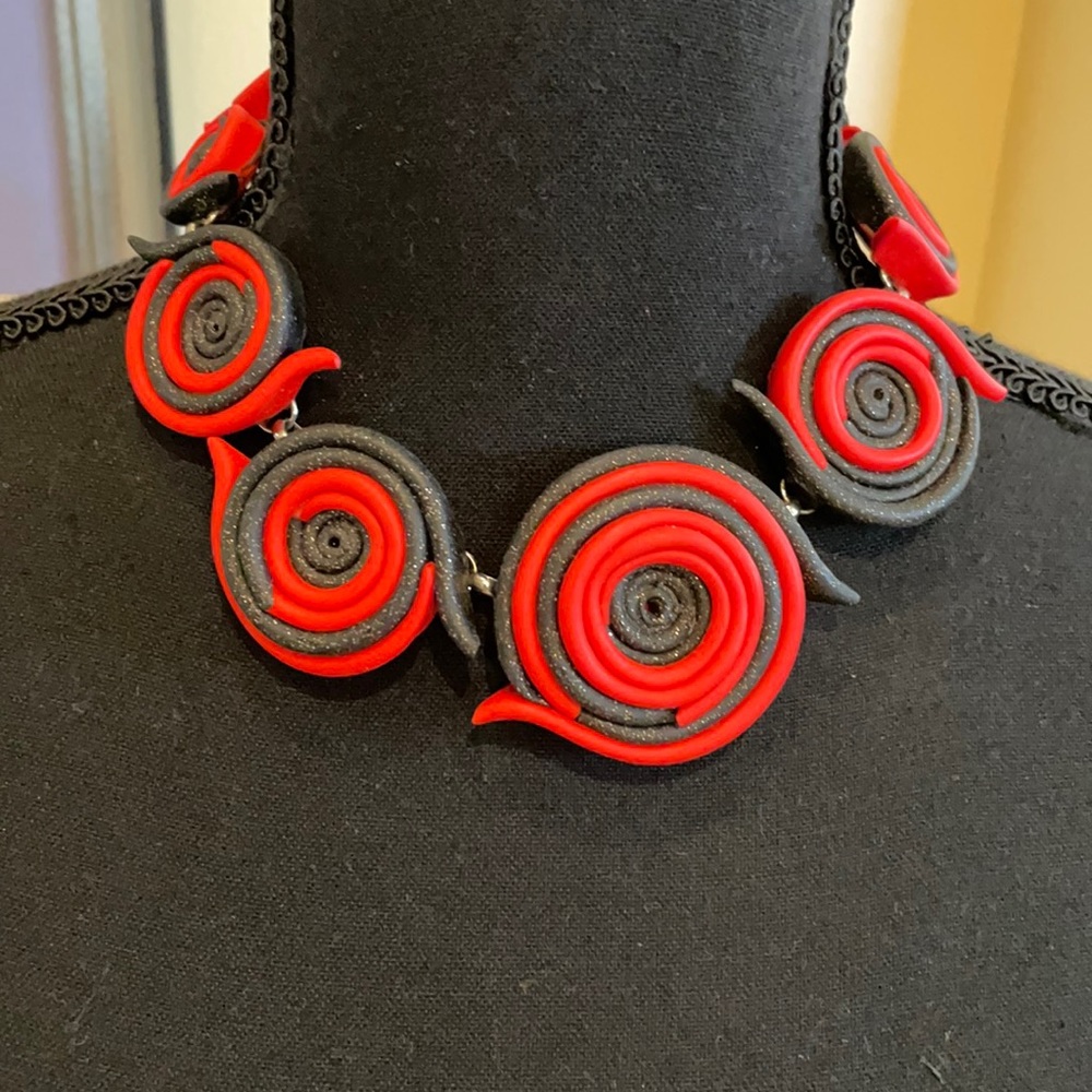 Red and black swirl necklace